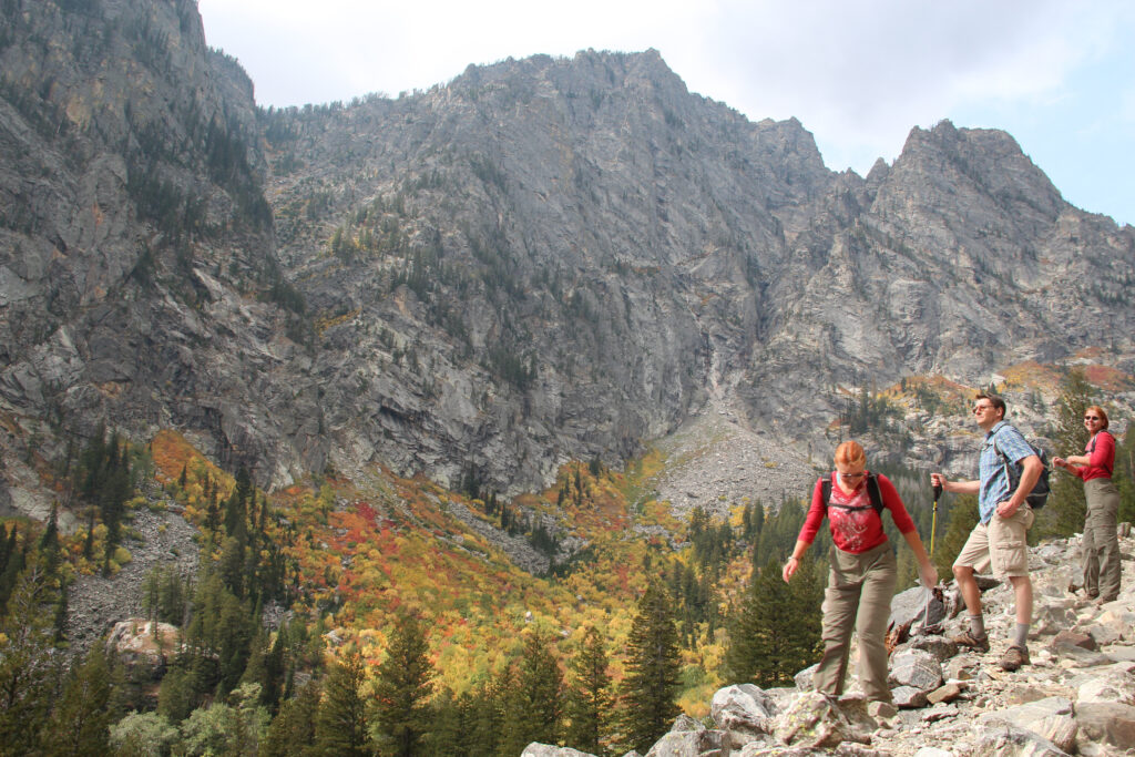Hikers exploring rocky alpine terrain near Jackson Hole