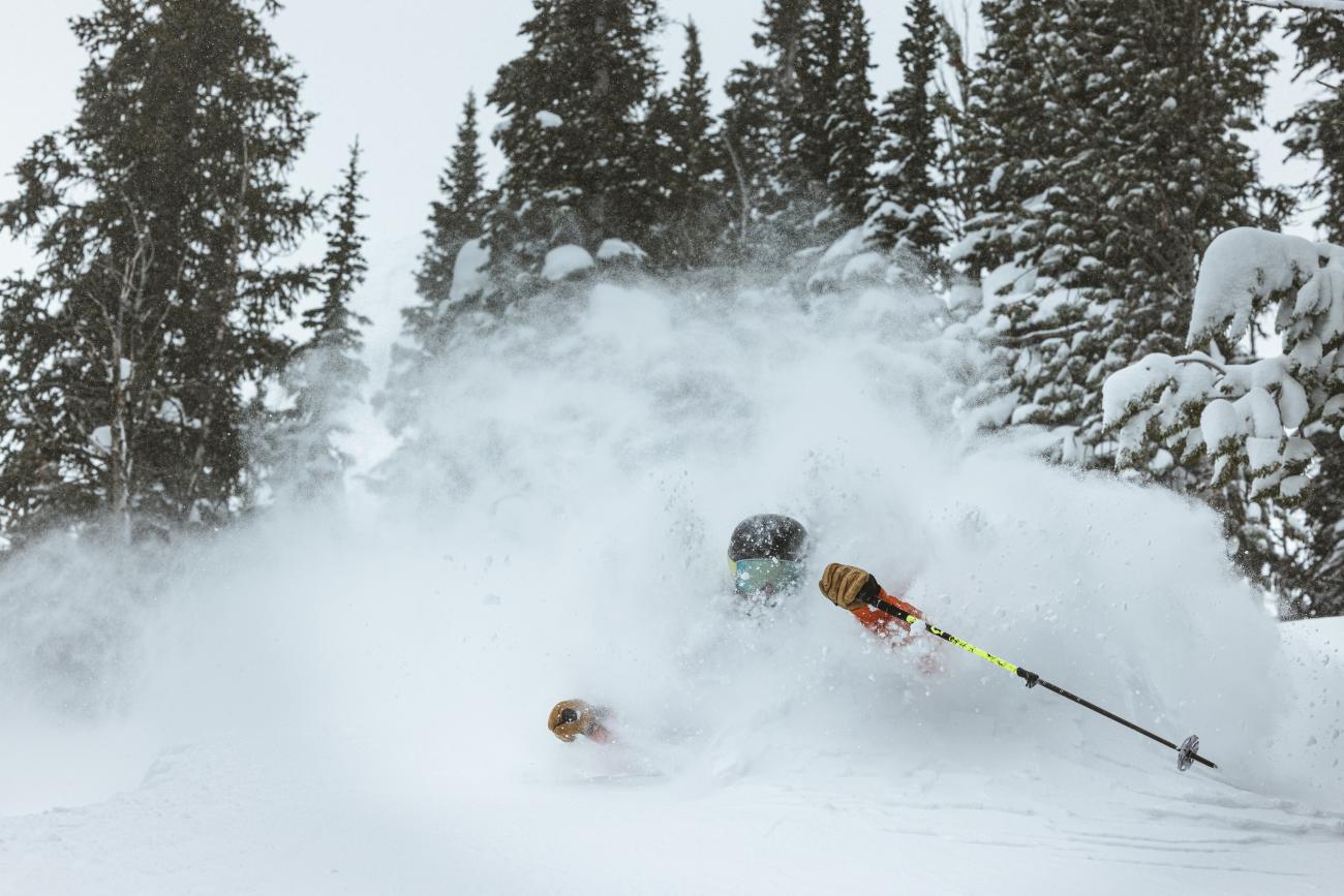 Skier riding through three feet of fresh snow in Jackson Hole
