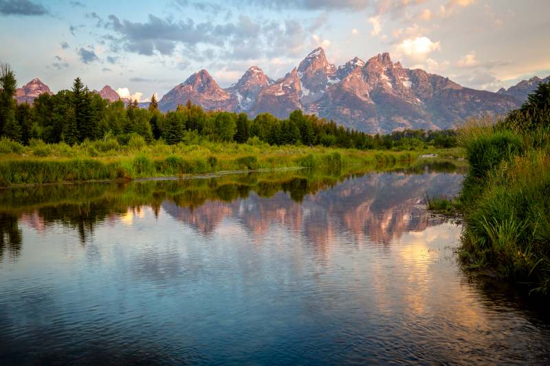 The Tetons, reflected in the Snake River at sunrise