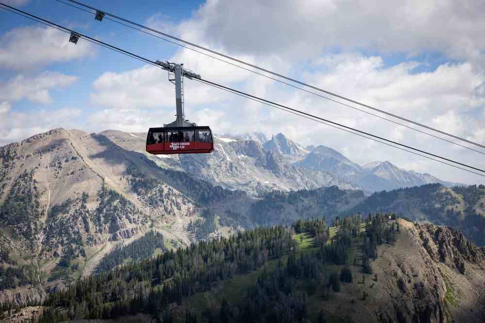An aerial tram soars high over the Teton Range