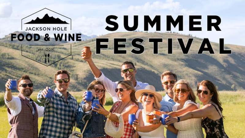 People enjoy an outdoor wine tasting