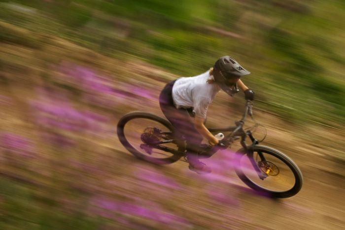 mountain biker speeding downhill